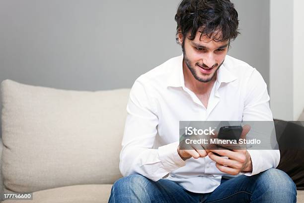 Man Using His Mobile Phone Stock Photo - Download Image Now - Adult, Adults Only, Beautiful People
