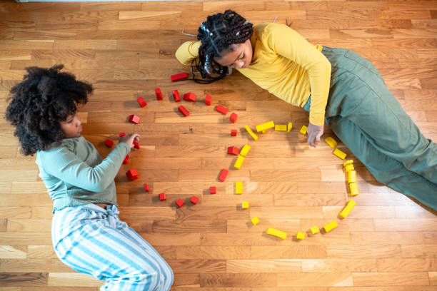 istock Mixed Race Sisters Building with Wooden Bricks 1777469437