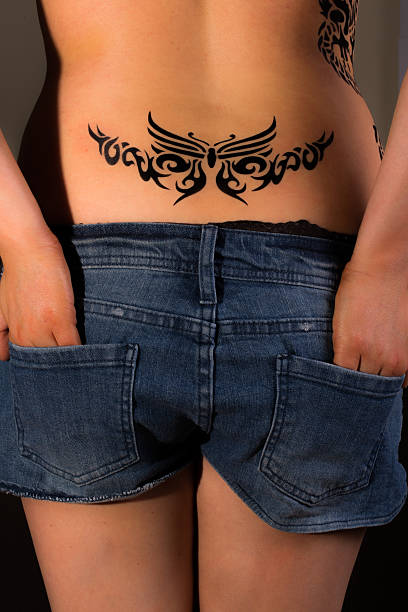 45 Lower Back Tattoo Stock Photos, Pictures & Royalty-Free Images - iStock  | Man lower back tattoo