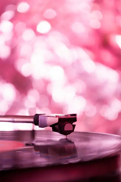 Colorful playing vintage gramophone with blurred blackground.