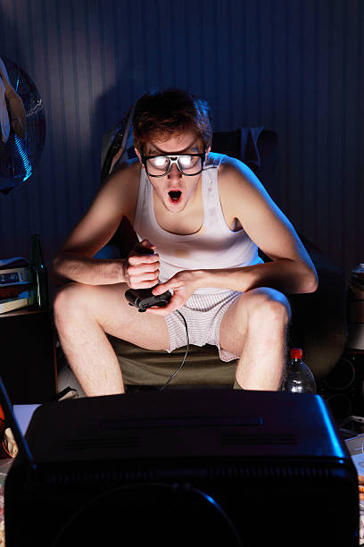 gamer nerd playing video games on television - gamer video game 1980s style television stok fotoğraflar ve resimler
