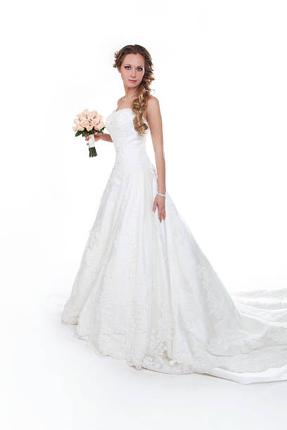 istock Beautiful bride in luxurious wedding dress isolated on white 177748682