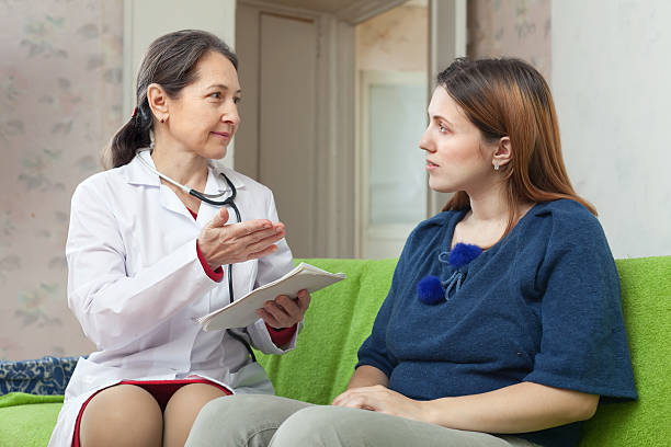 istock friendly mature doctor examining the  patient 177749241