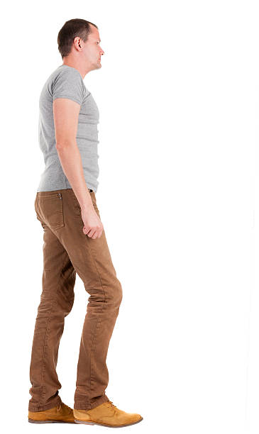 istock Back view of going  handsome man in jeans and  shirt. 177749279