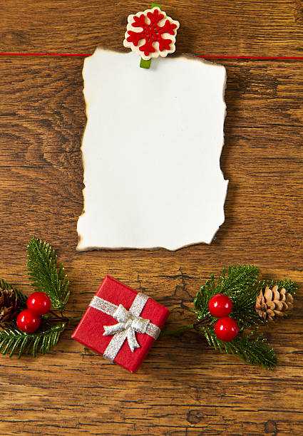 istock blank note with christmas decoration on wooden background 177749648
