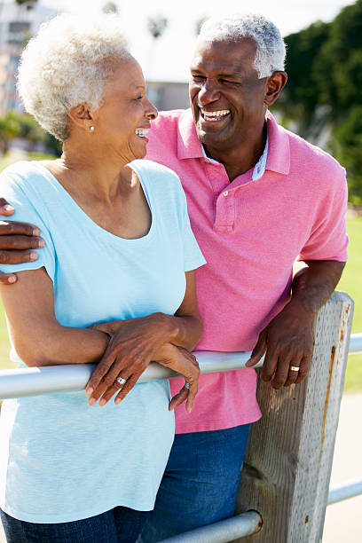istock Senior Couple Walking In Park Together 177750053