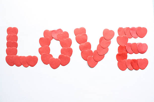 amor - heart shape confetti love single word - fotografias e filmes do acervo