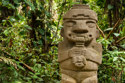 An ancient, flute playing, pre-columbian statue in San Agustin, Colombia