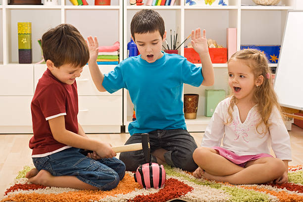 istock Children playing with a piggybank 177752172