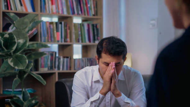 istock Asian man doing a desperate gesture during  therapy with a psychologist. 1777521743