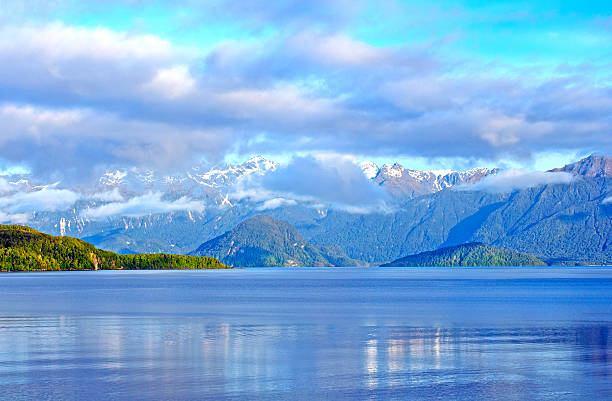 Morning clouds and mountains in the Fiordlands stock photo