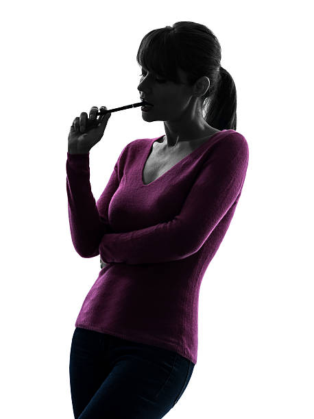 istock woman thinking chewing pen portrait silhouette 177753778