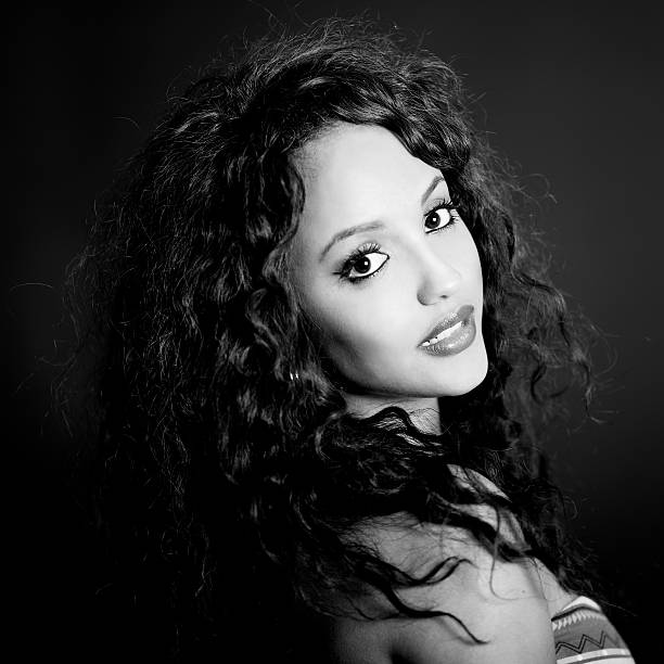 istock Attractive mixed woman on black background 177754154