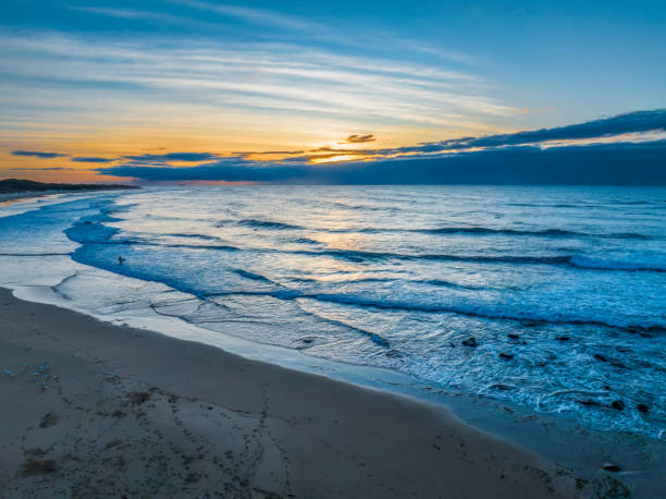 istock Sunrise seascape with waves 1777551083