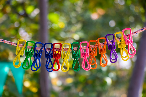 Colorful clothespins background in yard