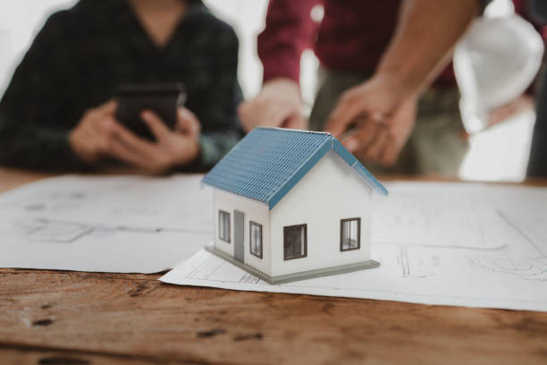 istock Commercial buildings are being evaluated by architects on what type of construction they need to be built,  Engineers are designing a structure according to blueprints. 1777564334