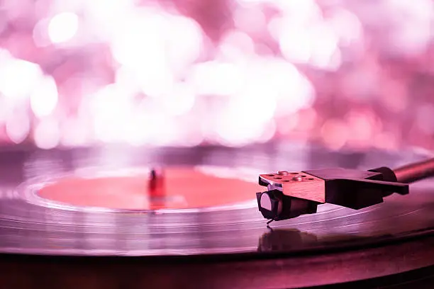 Colorful playing vintage gramophone with blurred blackground.