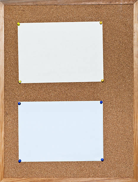 istock two sheets of paper on cork board 177756655
