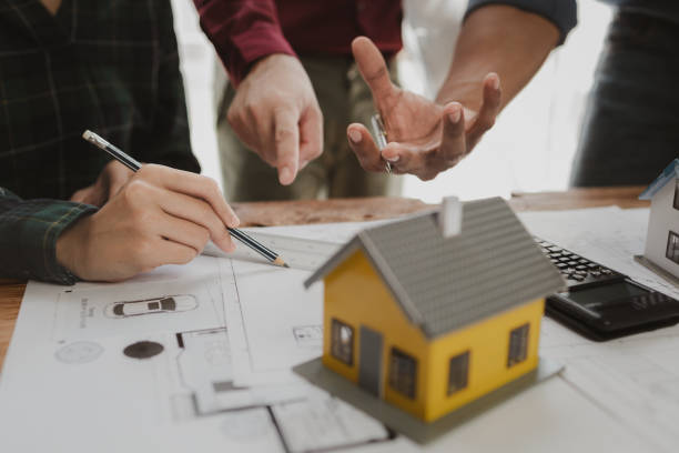istock Commercial buildings are being evaluated by architects on what type of construction they need to be built,  Engineers are designing a structure according to blueprints. 1777567018