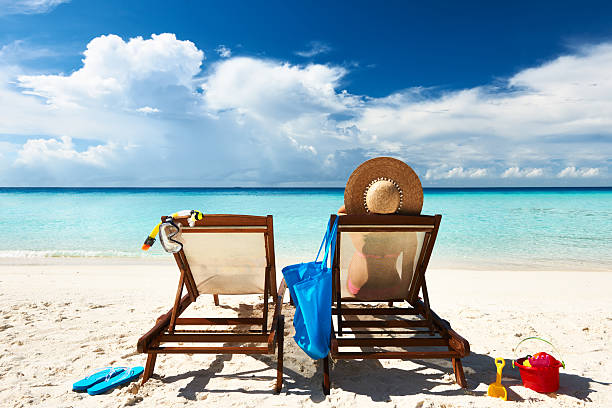 istock Woman on a tropical beach in chaise lounge 177757254