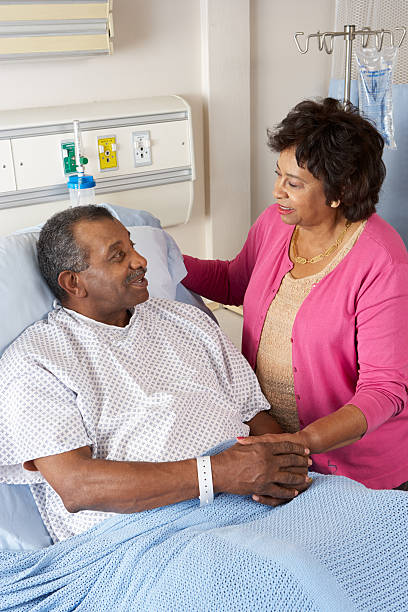 istock Senior Wife Visiting Husband On Ward 177757560