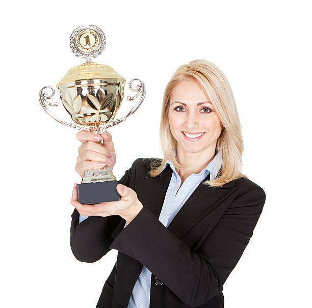 istock Businesswoman winning a trophy 177758398