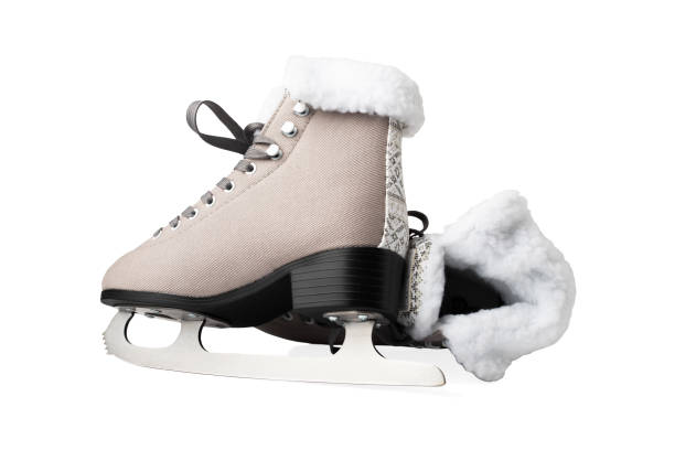istock ice skates isolated, women's figure skates with winter patterns 1777594676