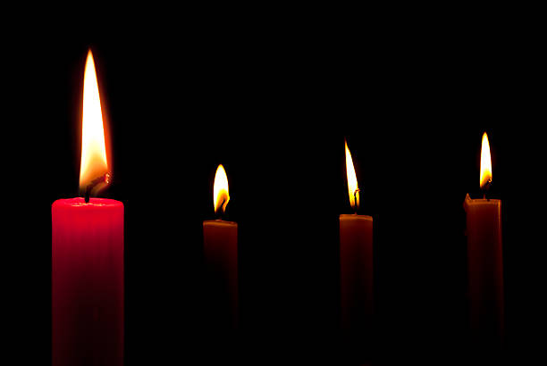 istock Four candles in the dark 177759499