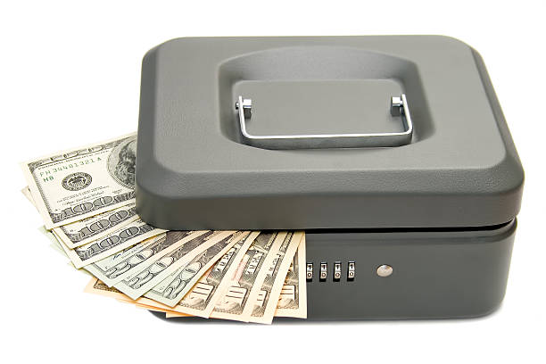 Cтоковое фото Закрыто cashbox with money isolated on white