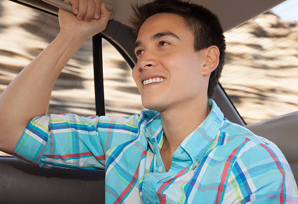istock Young male looking through car window. 177760105