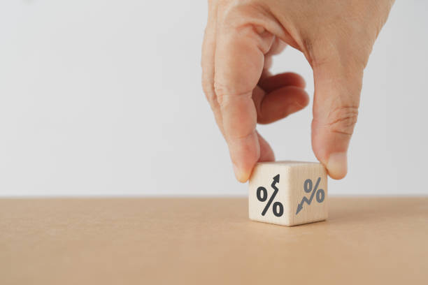 istock hand flipped wooden cube block from down to up percentage including copy space. For interest rate, financial stocks, ranking, GDP percent change, money exchange concepts 1777602297