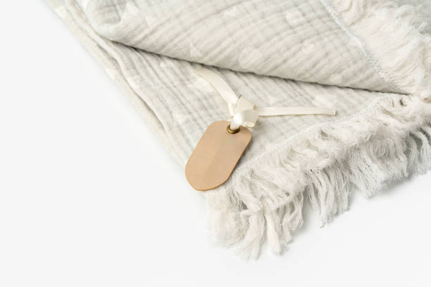 istock Warm cotton gray blanket with paper tag on white background 1777602309