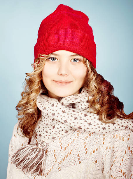 girl wearing ired  warm hat. Winter season stock photo