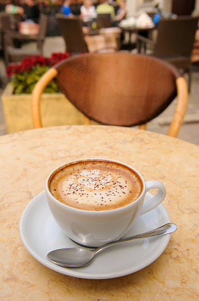 istock cappuccino cup on outdoor table 177761273