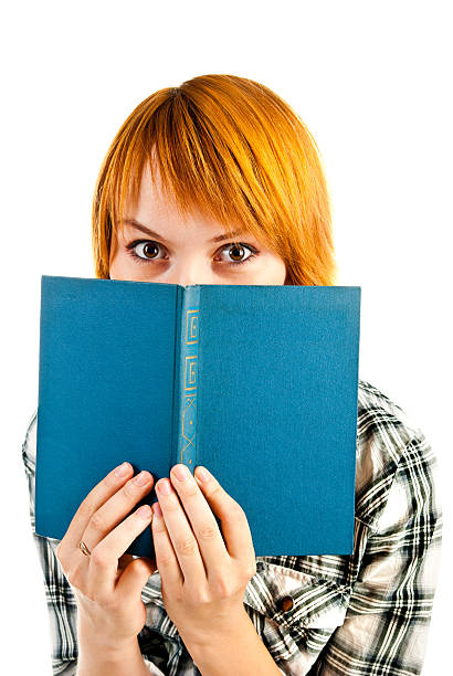 istock woman looking over book 177761569