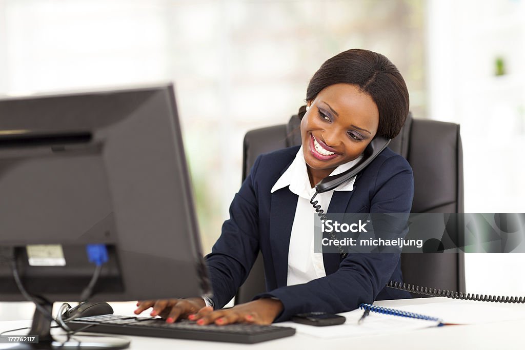 young african american businesswoman working beautiful young african american businesswoman working in office African Ethnicity Stock Photo