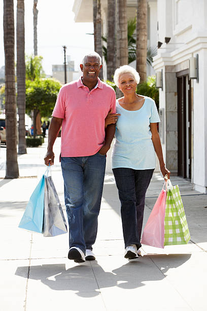 istock Senior Couple Carrying Shopping Bags 177762425