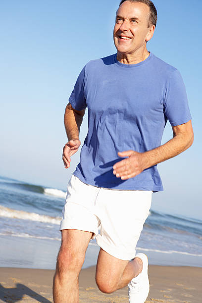 istock Senior Man Exercising On Beach 177762493