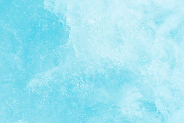istock Defocus blurred transparent blue colored clear calm water surface texture with splashes reflection. Trendy abstract nature background. Water waves in sunlight with copy space. Blue watercolor shine. 1777627622