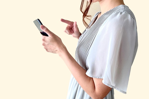 woman touching smartphone