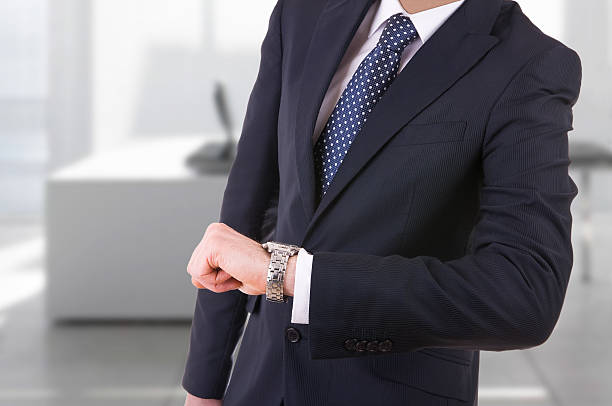 istock Businessman checking time on his wristwatch. 177763067
