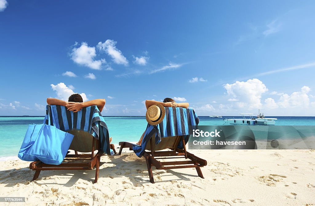Couple on a beach Couple on a tropical beach at Maldives Adult Stock Photo