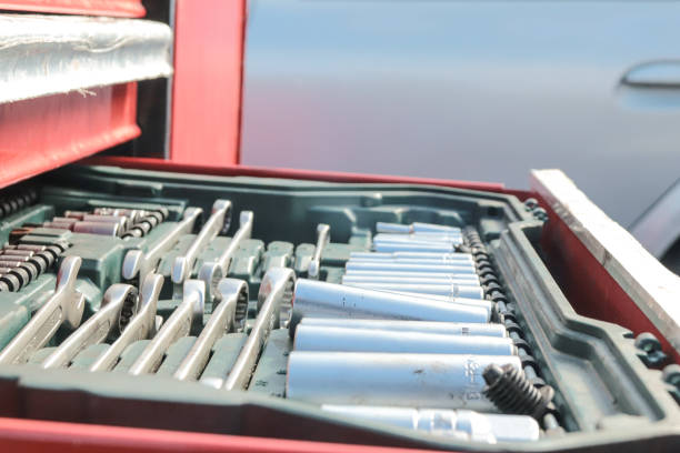 istock Man Holding A Socket Wrench From A Mechanic's Tool Cart 1777642408