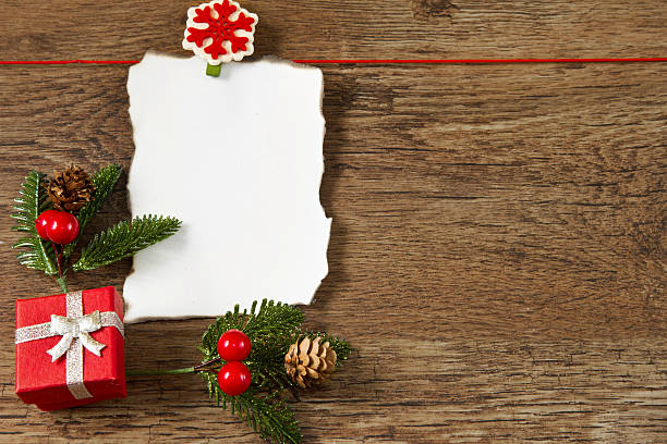 istock blank note with christmas decoration on wooden background 177764633