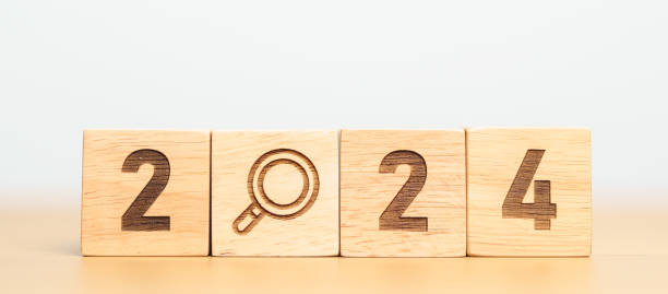 istock 2024 block with magnifying glass icon. SEO, Search Engine Optimization, hiring , Advertising, Idea, Strategy, marketing, Keyword, Content and New Year start concepts 1777647127