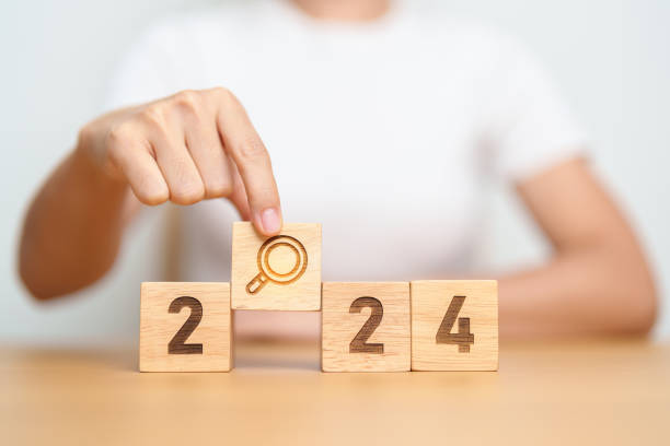 istock 2024 block with magnifying glass icon. SEO, Search Engine Optimization, hiring , Advertising, Idea, Strategy, marketing, Keyword, Content and New Year start concepts 1777647663