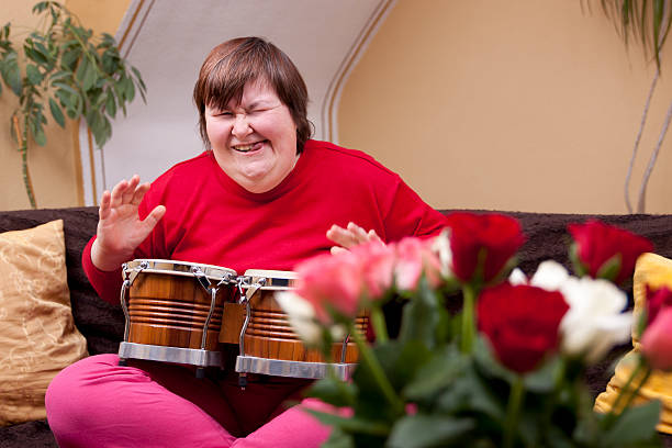 istock Mentally disabled woman plays drum 177766479