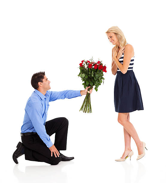 istock young man giving roses to a woman 177766564