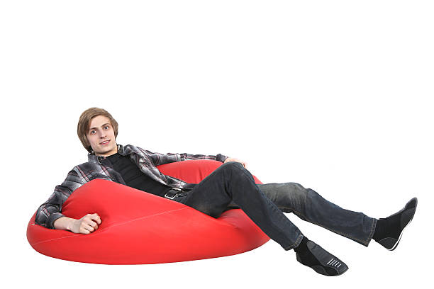 istock Smiling man sitting on bean bag 177766674