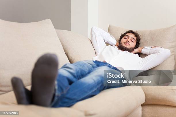 Man Sleeping On His Couch Stock Photo - Download Image Now - Adult, Adults Only, Beautiful People